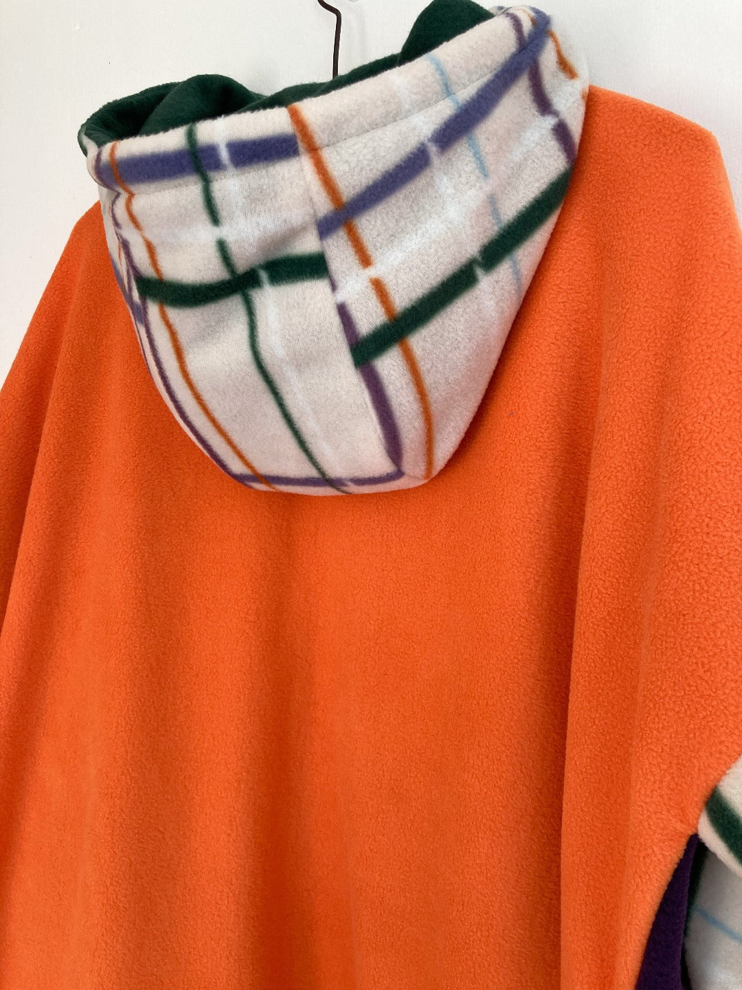 Purple and orange hoodie with contrast sleeves and hood. 