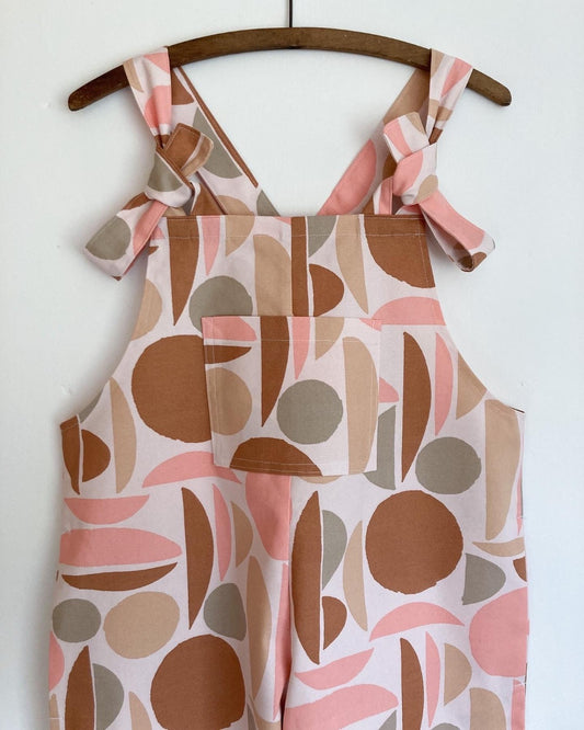Cotton dungarees with pink and beige geometric shapes