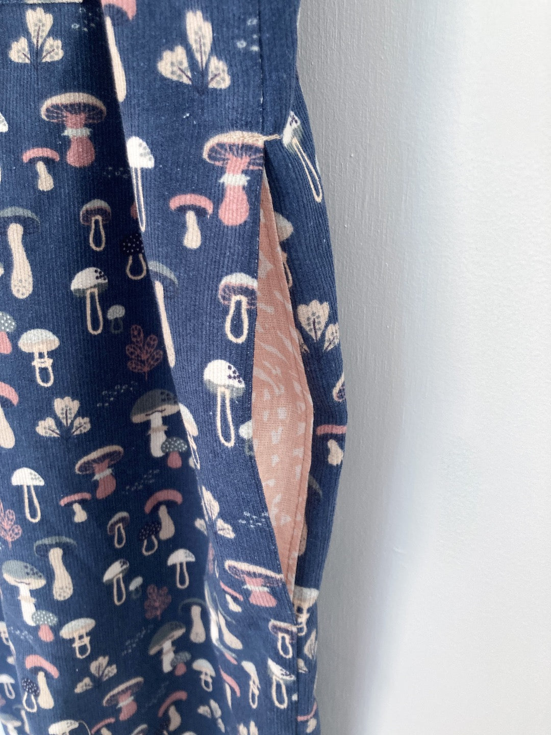 Cotton corduroy mushroom dungarees in blue pink and cream with cute pink inseam pockets