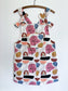 Multi coloured cotton pini dress with faces/shapes